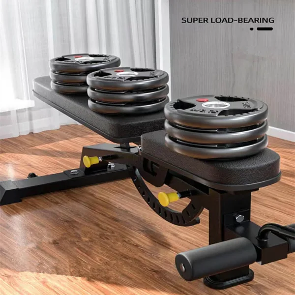 Weight bench with multiple weight plates in a room.