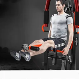 Man using a leg extension machine in a gym.