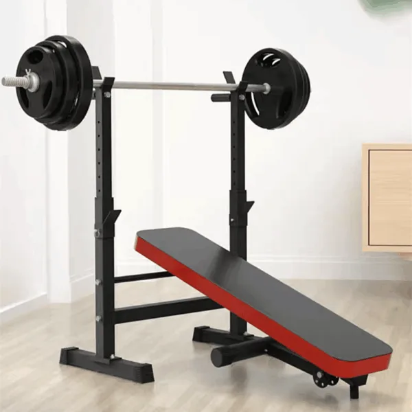 A flat bench with an attached rack and weight plates.