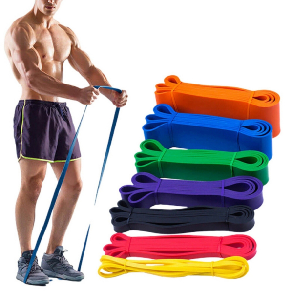 A man using resistance bands beside a set of resistance bands