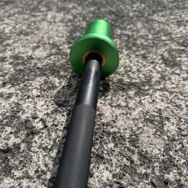 A kid bearing a Green barbell handle