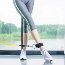 Fitness enthusiast demonstrating an upper thigh rope exercise