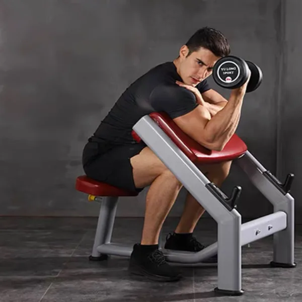 A man training with Commercial Preacher Curl Biceps Training Bench