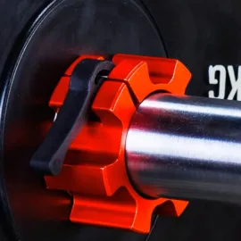 A red olympic barbell collar attached to a barbell sleeve