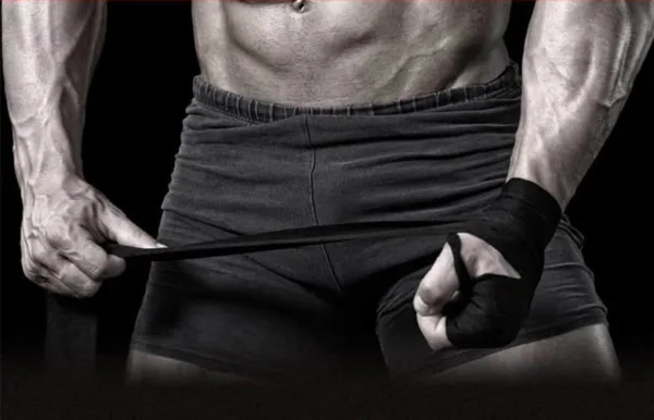 A boxing trainer with hand wraps