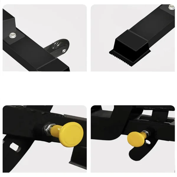 Close-up of black metal parts with yellow knobs on machinery.