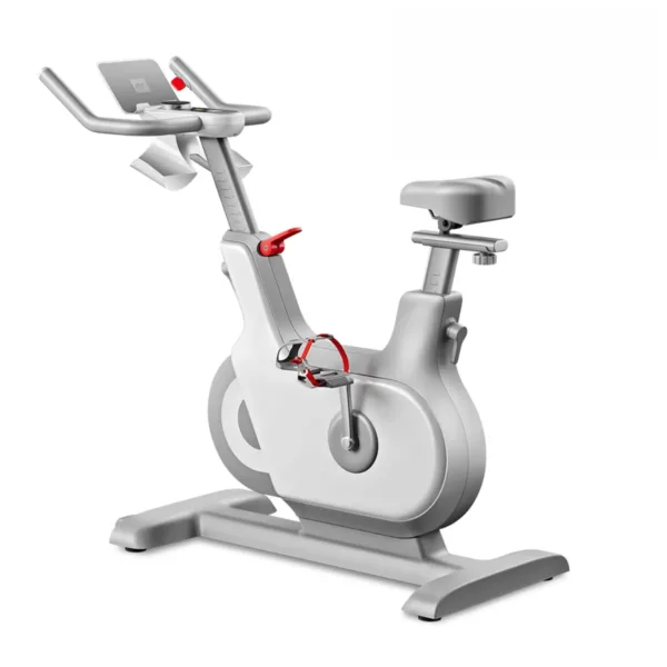 Modern white stationary exercise bike with red accents for indoor cardio workouts.