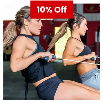 Two women using rowing machines in gym during 10% off fitness promotion.