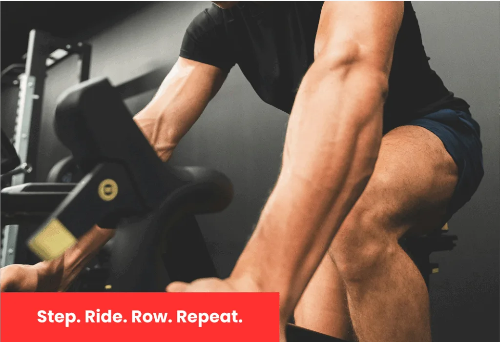 Man working out on rowing machine at gym for endurance and strength training.